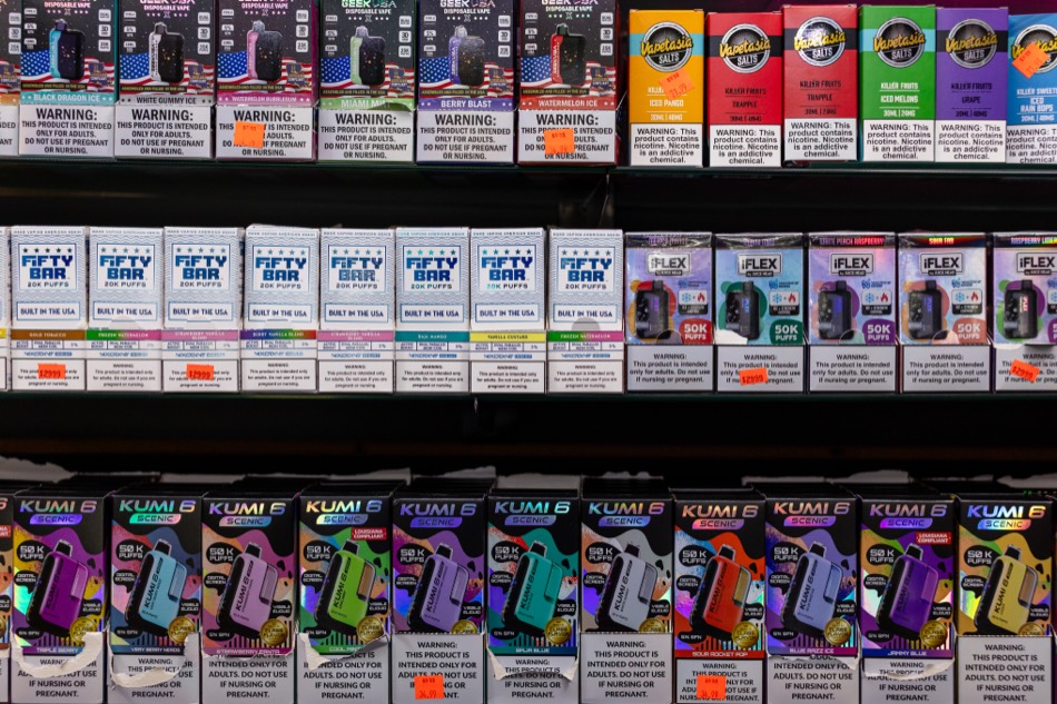 Disposable vape product wall with Geek Bar and Kumi boxes